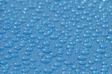 Water drops on the blue PVC surface