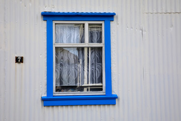 Seydisfjordur / Iceland - August 29, 2017: A wooden window in Seydisfjordur village, Iceland, Europe