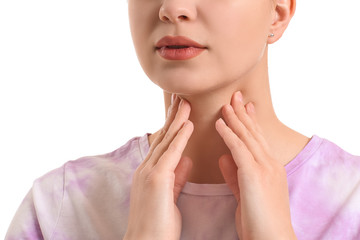 Obraz na płótnie Canvas Young woman with thyroid gland problem on white background