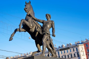 Horse tamers monument by Peter Klodt on Anichkov Bridge in Saint-Petersburg Russia.	
