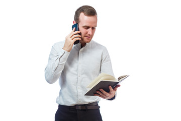 man businessman, teacher, mentor examines entries in your diary and talking on a cell phone....