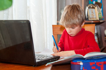 School kid in self isolation using laptop for homework, Social Distance learning online education...
