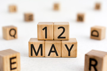 May 12 - from wooden blocks with letters, important date concept, white background random letters...