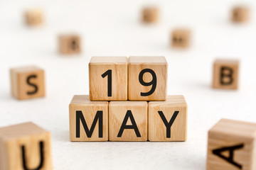 May 19 - from wooden blocks with letters, important date concept, white background random letters...