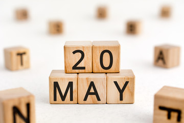 May 20 - from wooden blocks with letters, important date concept, white background random letters...