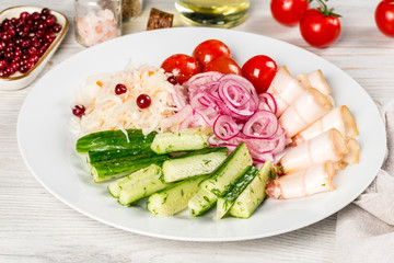 Assorted pickles cucumbers, tomatoes, lard, onions to vodka.