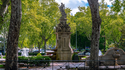 Fototapeta na wymiar Madrid / Spain-04/19/20 Apollo fountain on the Paseo del Prado in Madrid, during the Covid 19 pandemic guarded by the police