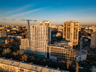 Evening Voronezh, construction of modern high buildings, aerial view from drone