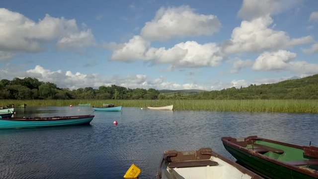 aerial approach of wooden boats on a lake