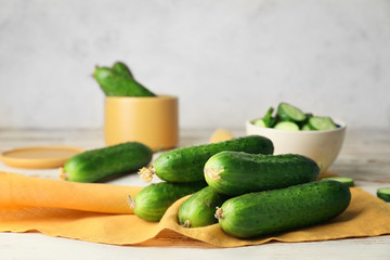 Green cucumbers on wooden table