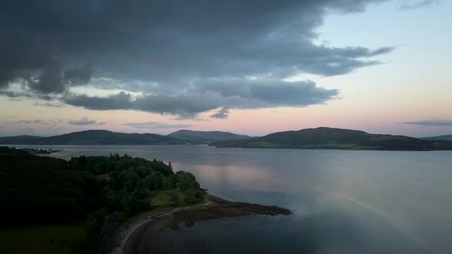 aerial sunset over lake approach