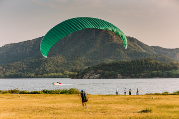 A man on a paraglider prepares to fly