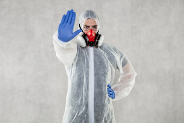 portrait of a virologist in a protective suit