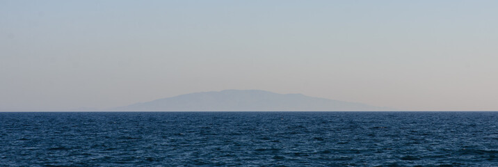Fototapeta premium Lonely volcanic island far above the water.