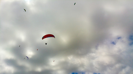 Hanggliders against overcast sky, Cape Town, South Africa