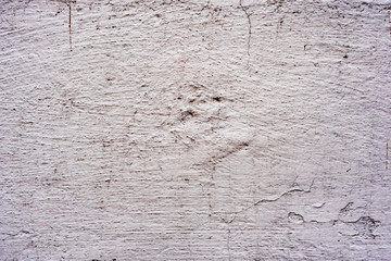 Texture of a concrete wall with cracks and scratches which can be used as a background