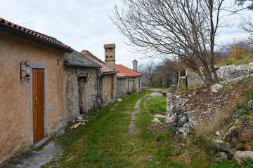 Fototapeta na wymiar A street in the old historic hill village of Stanjel in the Komen municipality of Primorska, south west Slovenia 