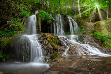 Fototapeta na wymiar Waterfall in the forest. Beautiful waterfall Dokuzak in Strandzha Mountain, Bulgaria at spring. Green forest landscape near Bourgas