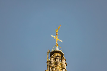 Fototapeta na wymiar Gilded statue on top of Guildhouses view from Grand Market Square in Antwerp, Belgium
