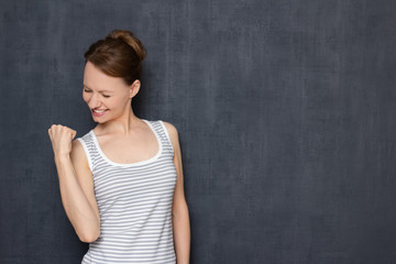 Portrait of happy overjoyed woman rejoicing at victory or success