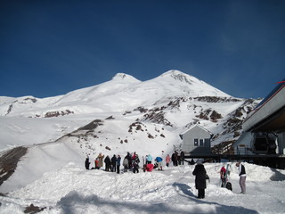 skiers on the top of mountain