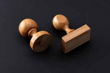 Wooden rubber stamps isolated on the black background.