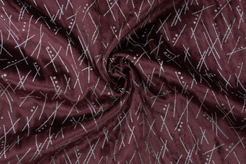 Original burgundy corduroy fabric with silver abstract pattern. Largely removed texture of the fabric is useful as a background. 