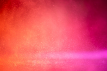 Bokeh backgrounds orange and red and pink water splash.