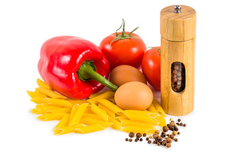 Pasta, tomatoes and spices on a white background