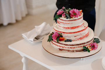 A large white cake sitting on top of a table