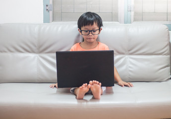 young boy with laptop