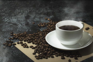 Coffee mugs and coffee beans on a texture background