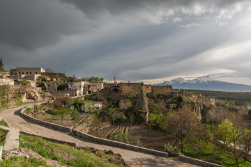 Fototapeta na wymiar Guzelyurt city spring landscape dramatic cloudy sky Cappadocia 