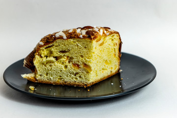 Panettone, Italian Christmas bread, with a brioche-like dough infused with a vanilla bean and studded with rum-soaked raisins and candied orange peel