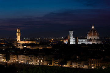 Fototapeta na wymiar Florence at dusk - Panorama of Florence, Tuscany, Italy after sunset with the city center and landmarks: Lungarno, cathedral and Palazzo Vecchio (medieval city hall) illuminated under the evening sky
