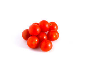 Little red tomatoes on a white background