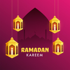 Iit candles inside arabic golden lanterns, and mosque silhouette on fuchsia color background for Islamic holy month of Ramadan Kareem occasion.