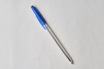 Blue plastic pen on a white background. Isolate