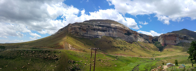 Fluffy clouds over rock formations in the Golden Gate Highlands National Park, Clarens, Free State, South Africa