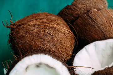 Coconuts on a bright wooden background close-up