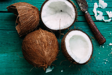 Fototapeta na wymiar Coconuts on a bright wooden background close-up
