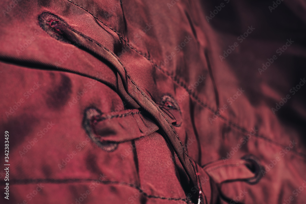 Poster Close up beautiful red textile cloth background with stitching. Macro photography background material view.