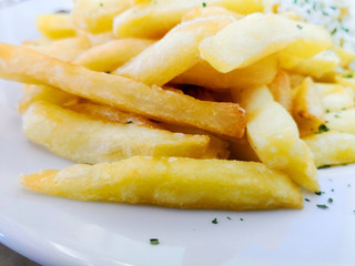 Golden French fries potatoes ready to be eaten