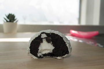 Inside of a half-bitten Coconut and chocolate cake