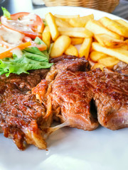 juicy steak beef meat with tomato and french fries