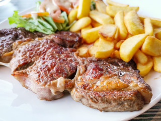 juicy steak beef meat with tomato and french fries