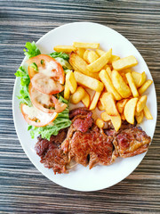 juicy steak beef meat with tomato and french fries