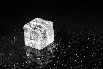 ice cubes on black table background.