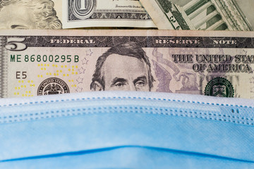 Medical face mask on Abraham Lincoln. Crisis and finance concept.