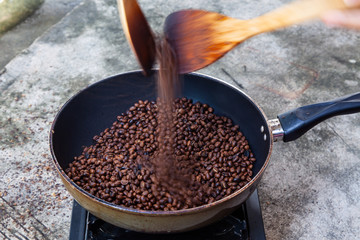 Traditional roasting coffee at home,  freshly roasted coffee beans.